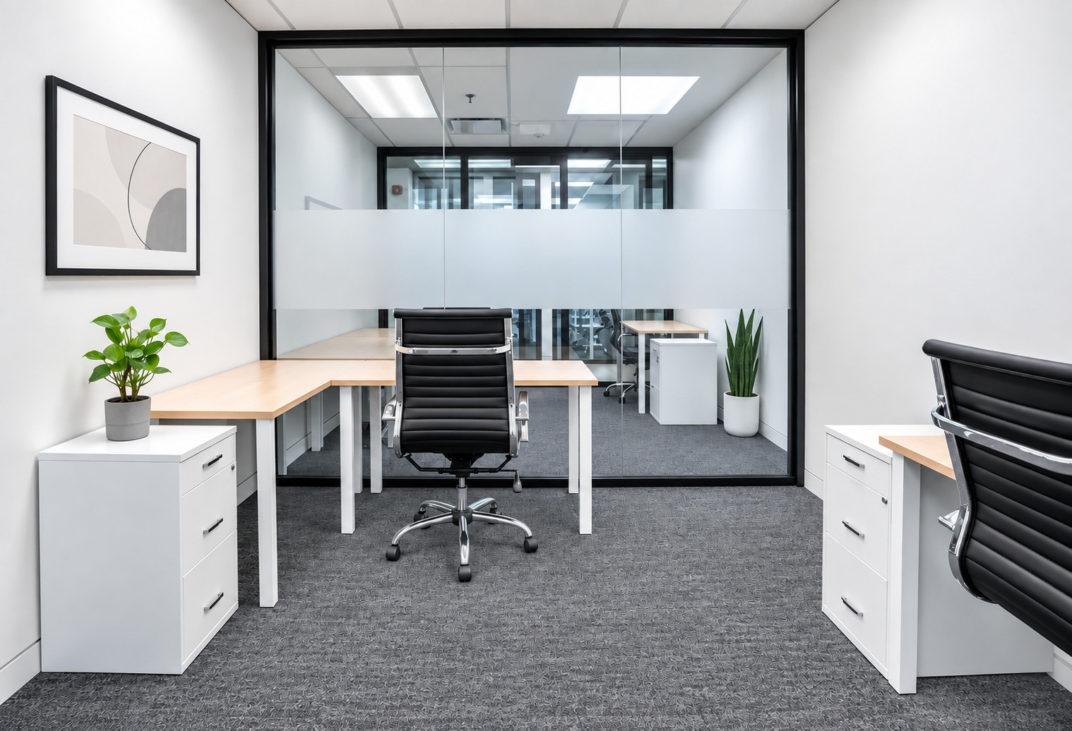 Private office with desk and glass partition at SABA Offices